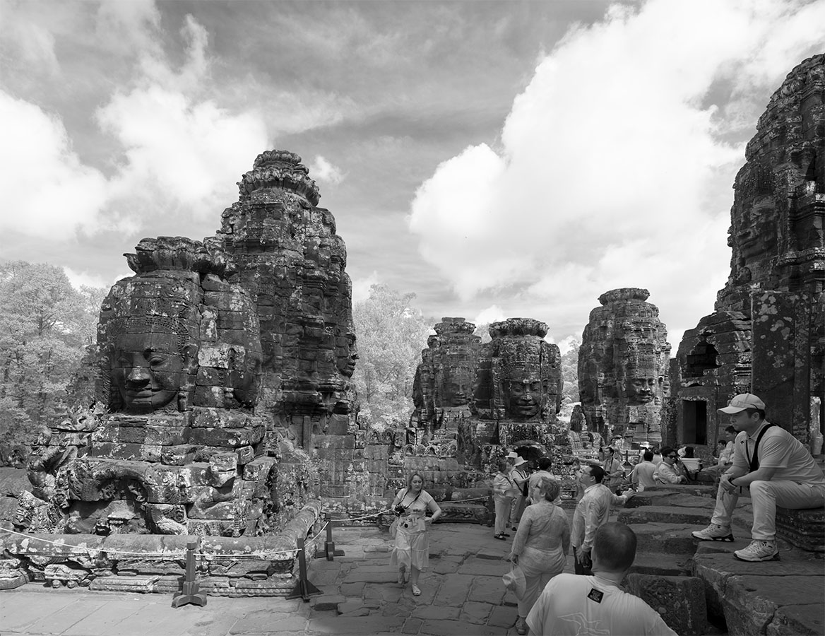 Tourists on the Terrace of the Bayon Temple, Angkor Complex.